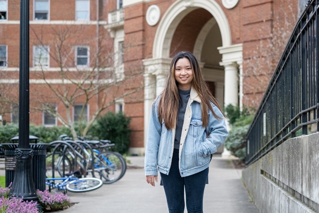 Snowy, a student from Vietnam, poses on Oregon State University's campus in winter.