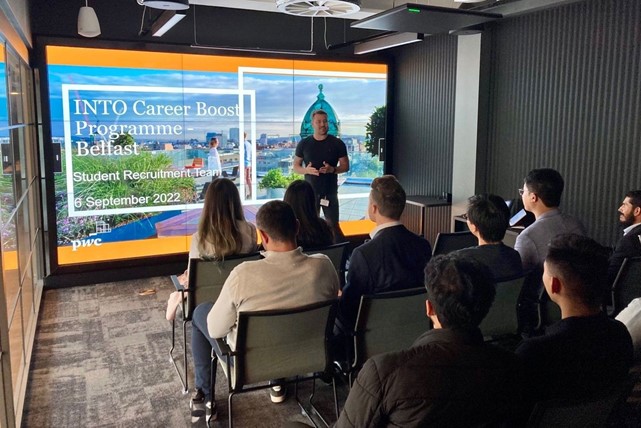 International students from Queen's University Belfast hear presentation at PwC office in Merchant Square.